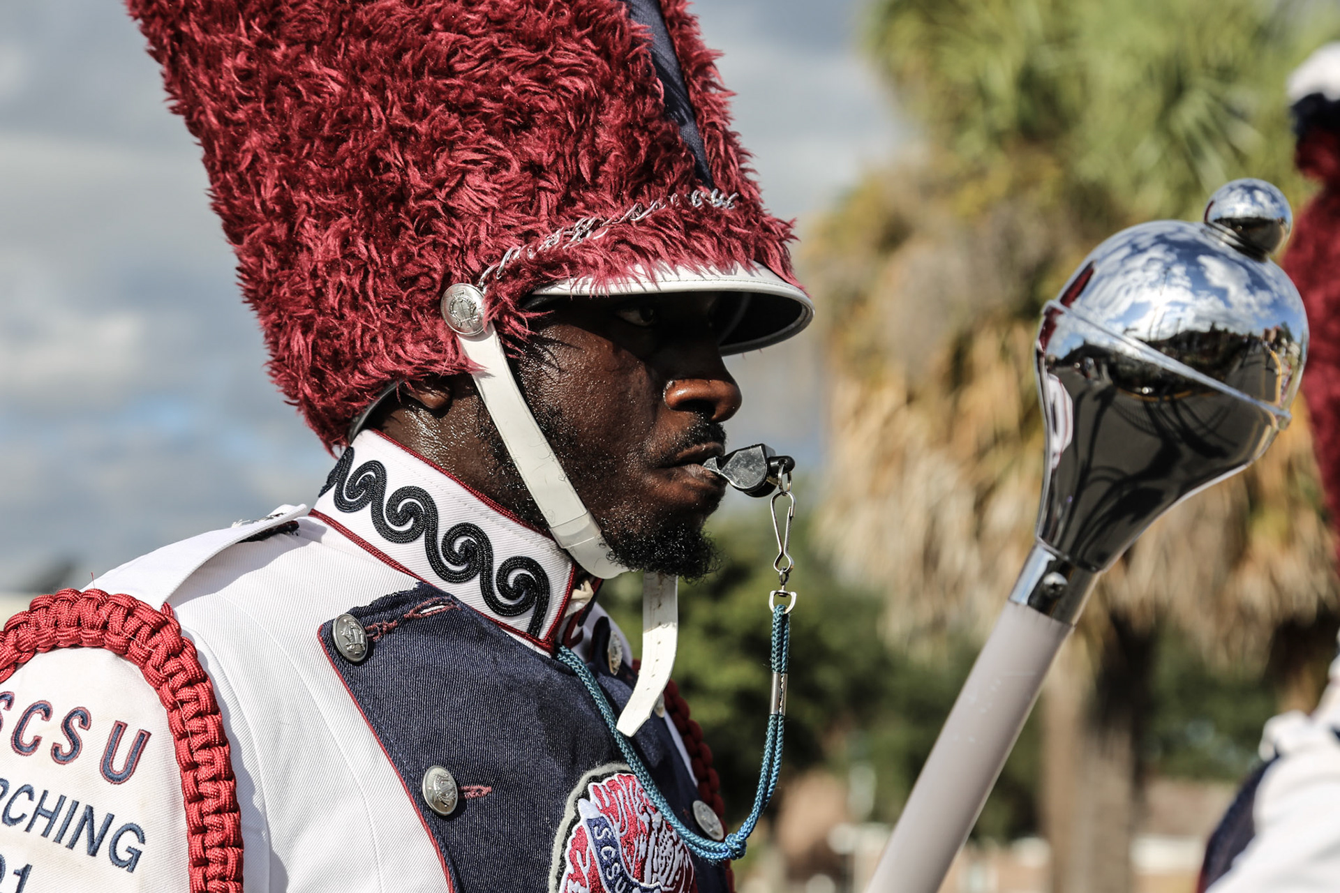 Drum major, whistle raised / photograph by Xavier Underwood